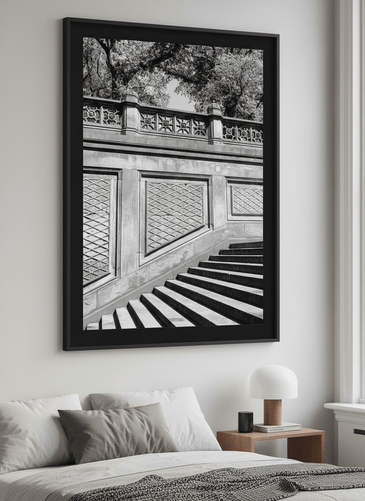 Minimalist artwork displayed in a calm, light-filled bedroom interior