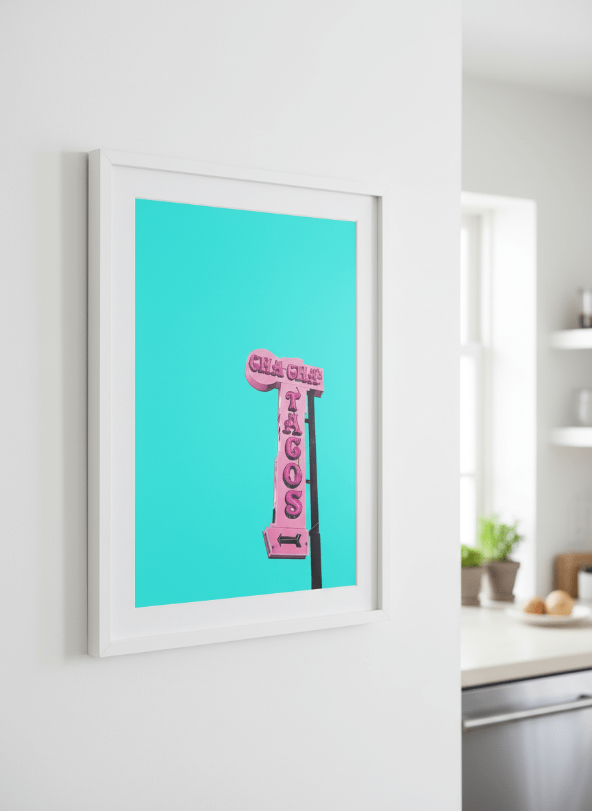 Artwork styled on the wall of a bright modern kitchen