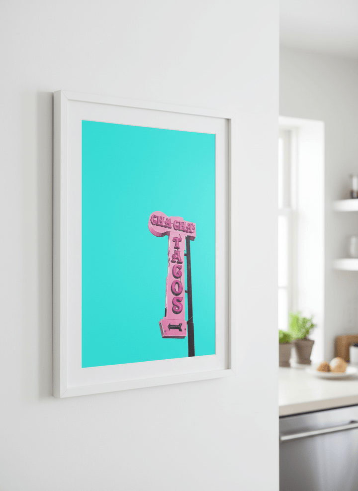 Artwork styled on the wall of a bright modern kitchen