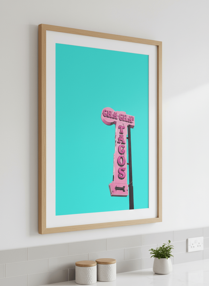 Artwork styled on the wall of a bright modern kitchen