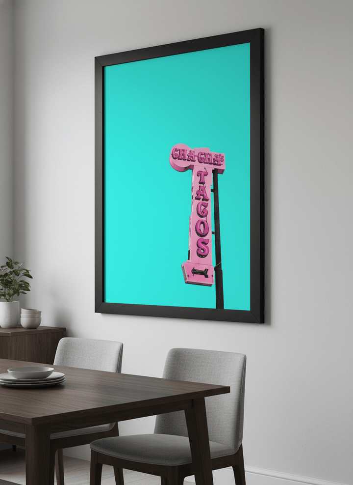 Wall art styled above a dining table in a contemporary home