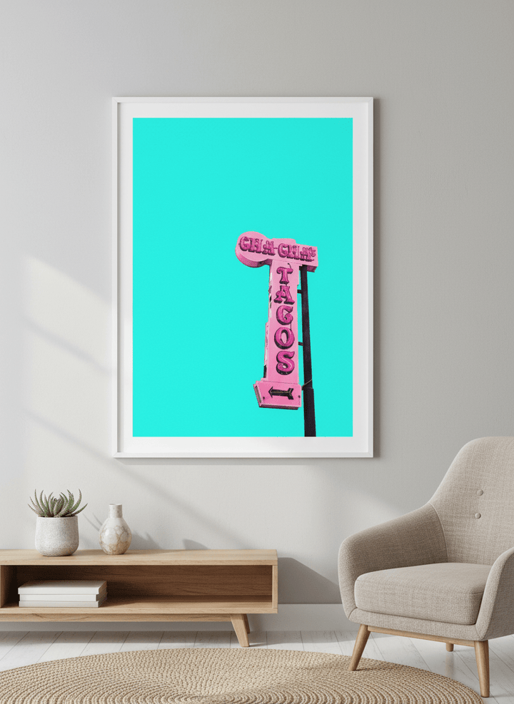Modern wall art styled above a sofa in a neutral living room