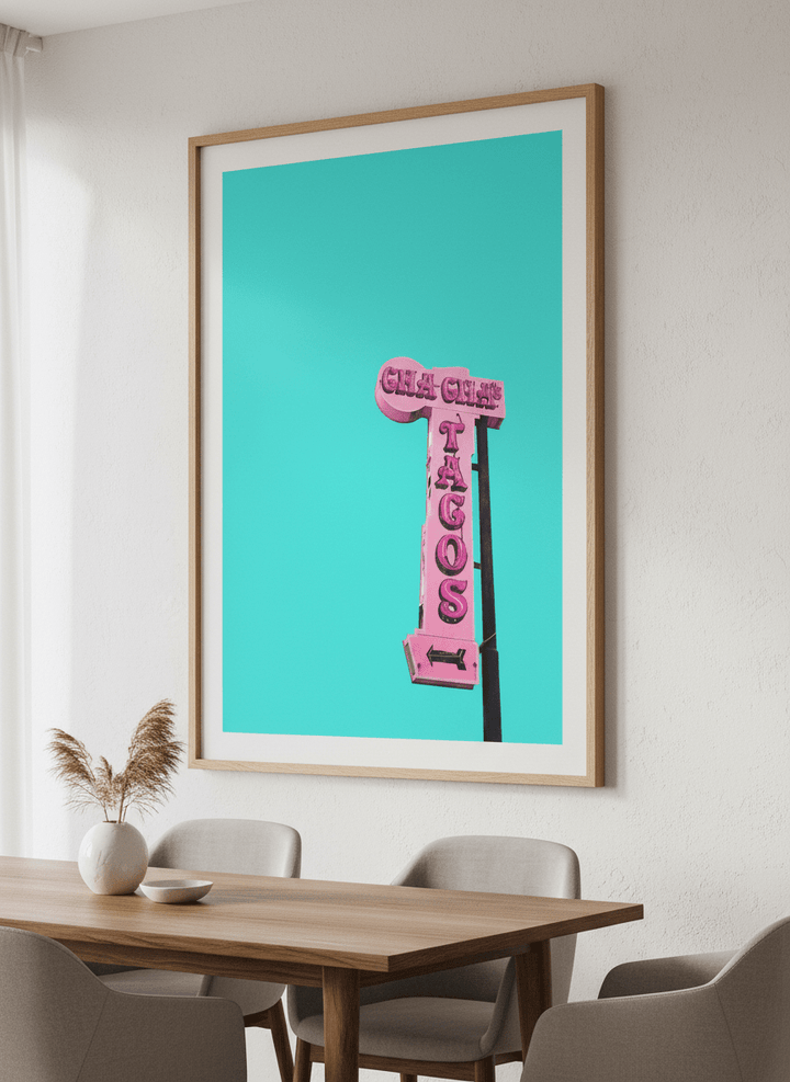 Wall art styled above a dining table in a contemporary home