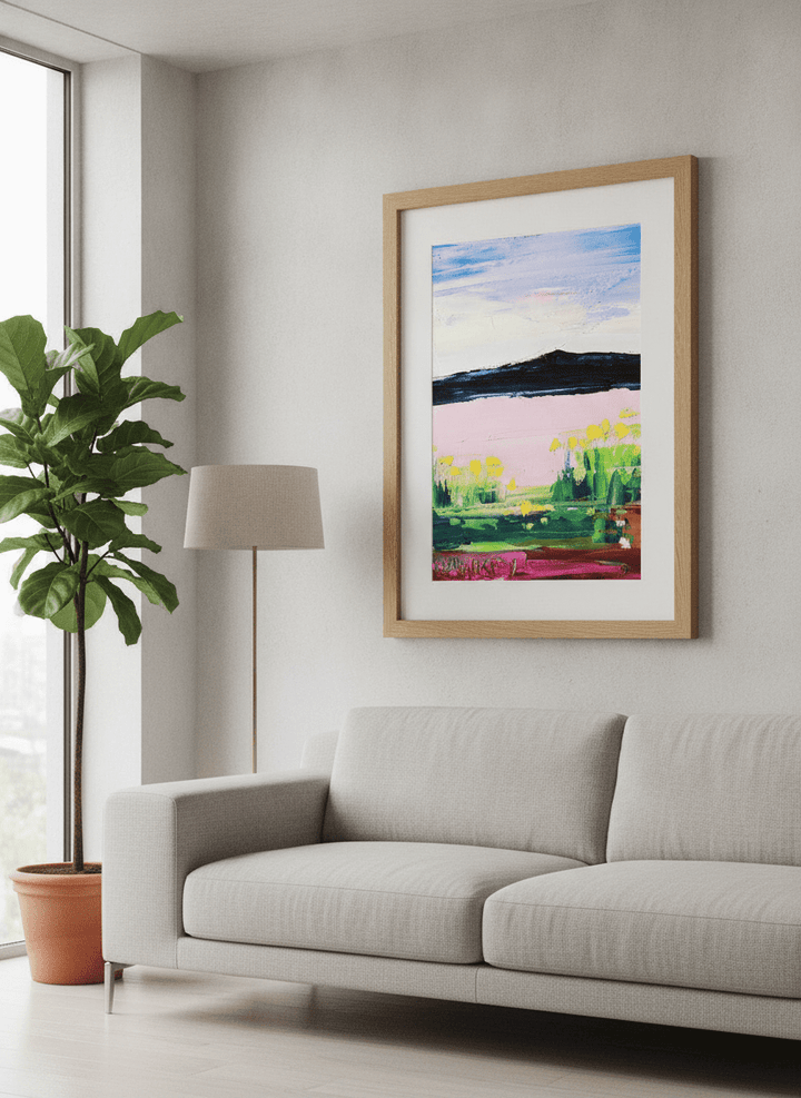 Modern wall art styled above a sofa in a neutral living room