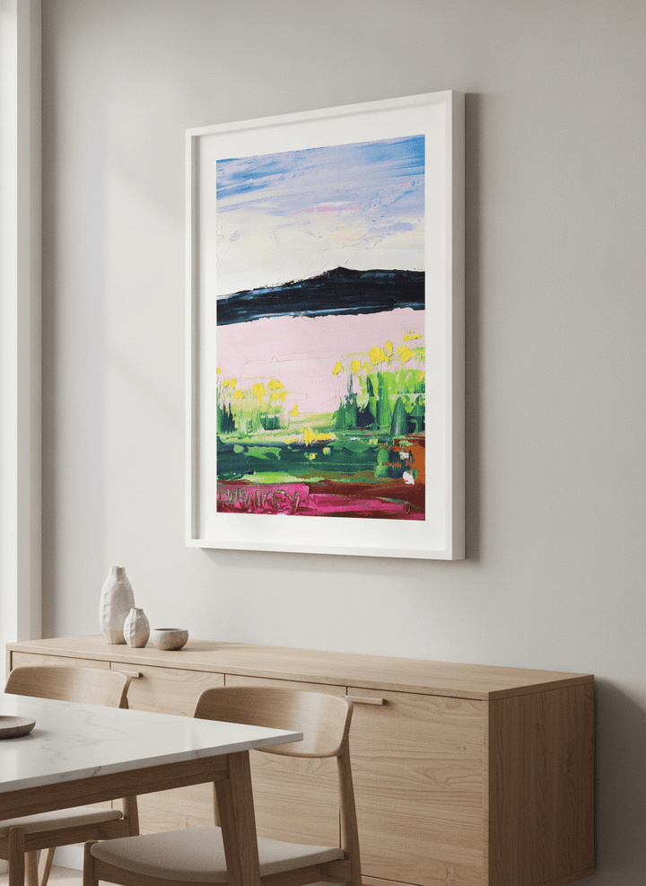 Wall art styled above a dining table in a contemporary home