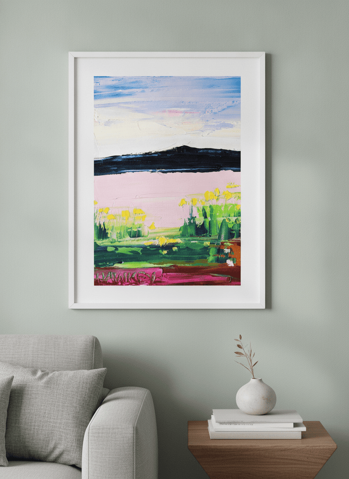 Modern wall art styled above a sofa in a neutral living room
