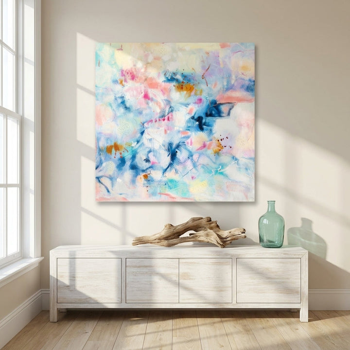 Stretched canvas wall art styled on the wall in a coastal living room