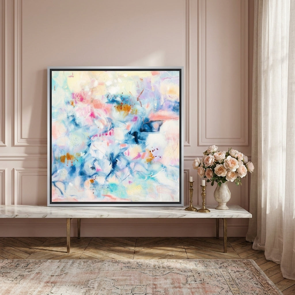 Canvas wall art with a silver leaf surround standing on a console in a Parisian bedroom