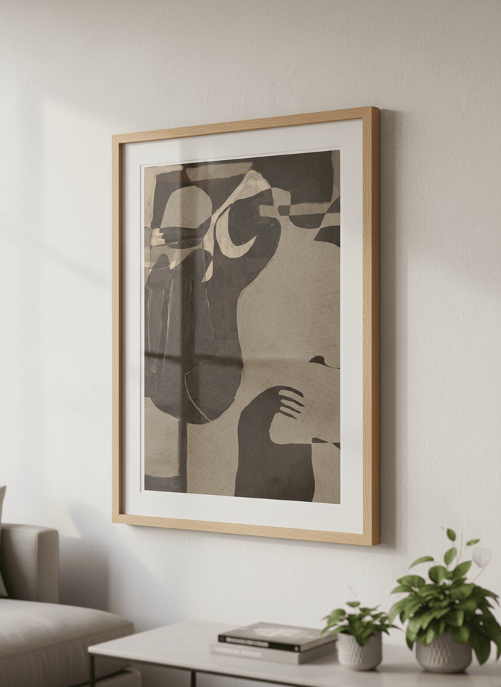 Modern wall art styled above a sofa in a neutral living room