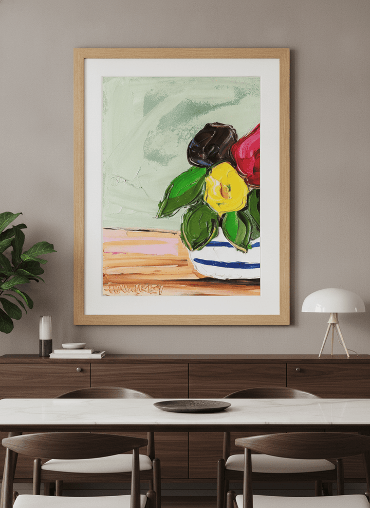 Wall art styled above a dining table in a contemporary home