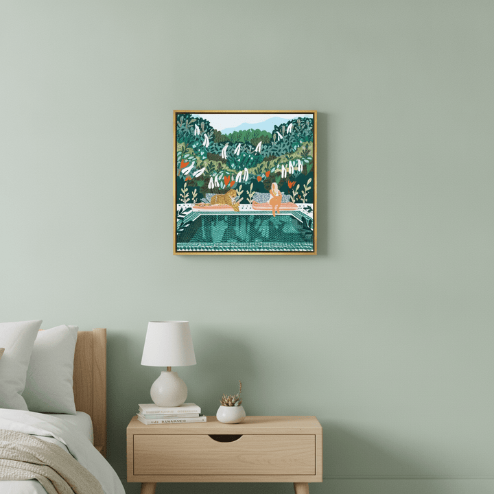Canvas wall art with a gold leaf surround styled in a calm, light-filled bedroom