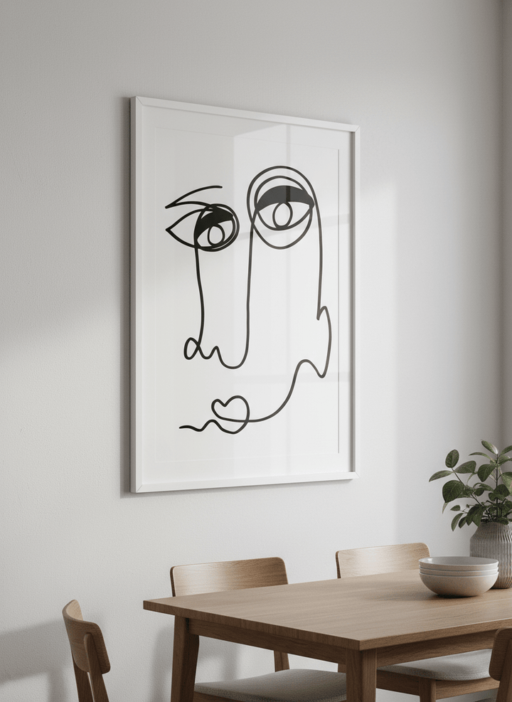 Wall art styled above a dining table in a contemporary home