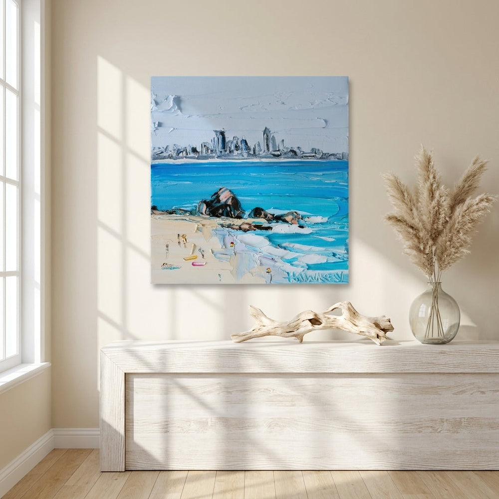 Stretched canvas wall art styled on the wall in a coastal living room