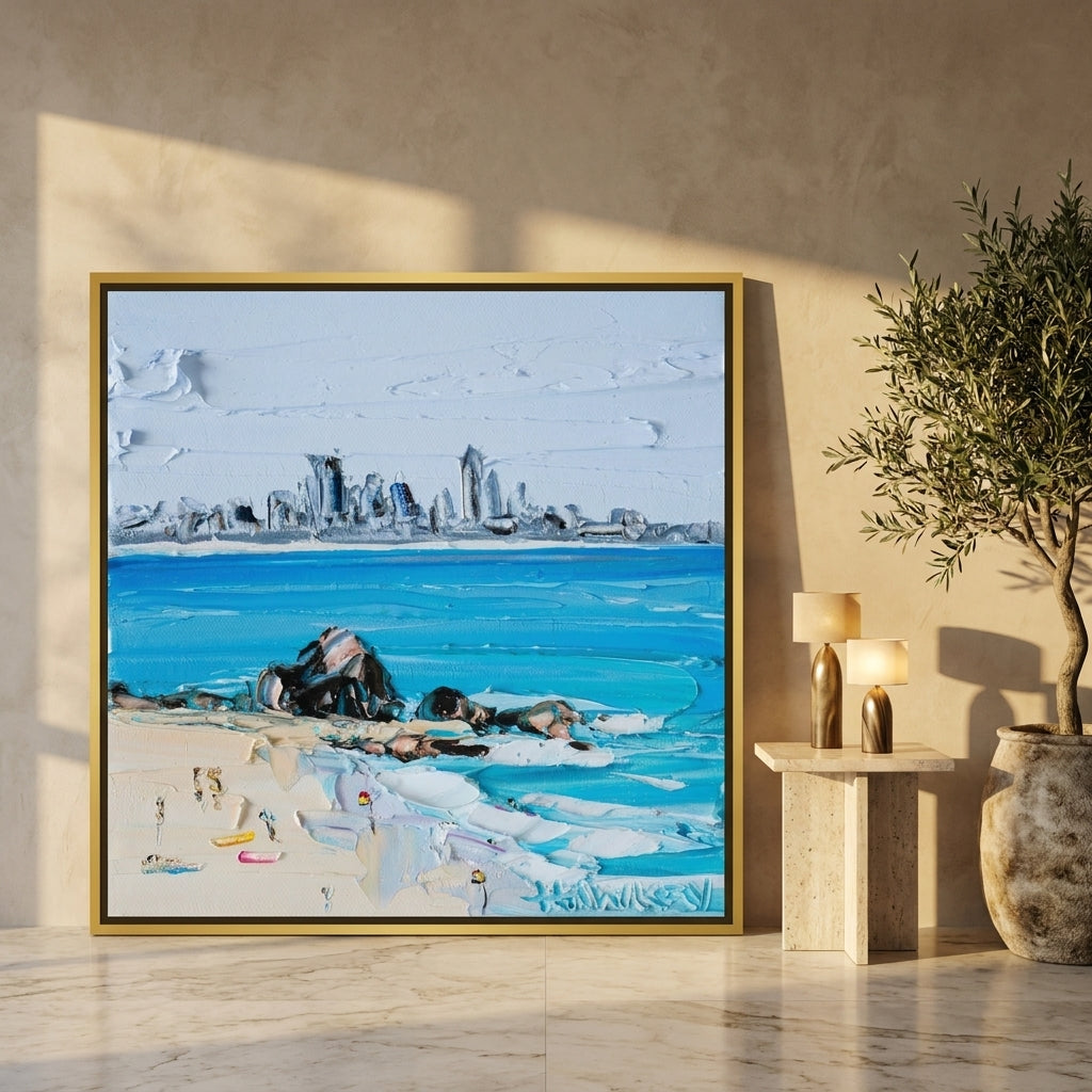 Oversized statement canvas wall art with a gold leaf surround leaning against the wall in a luxe dining room