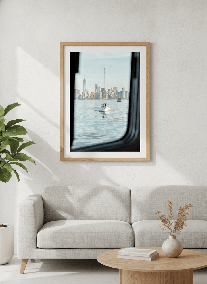 Modern wall art styled above a sofa in a neutral living room