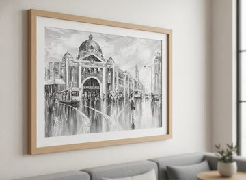 Modern wall art styled above a sofa in a neutral living room