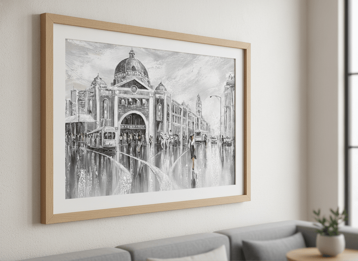 Modern wall art styled above a sofa in a neutral living room