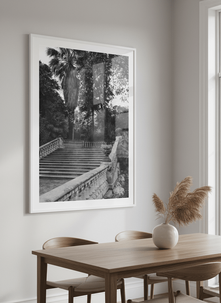 Wall art styled above a dining table in a contemporary home