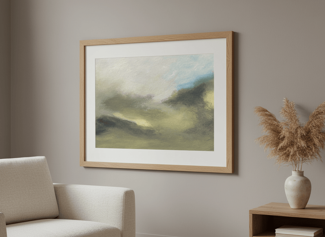 Modern wall art styled above a sofa in a neutral living room