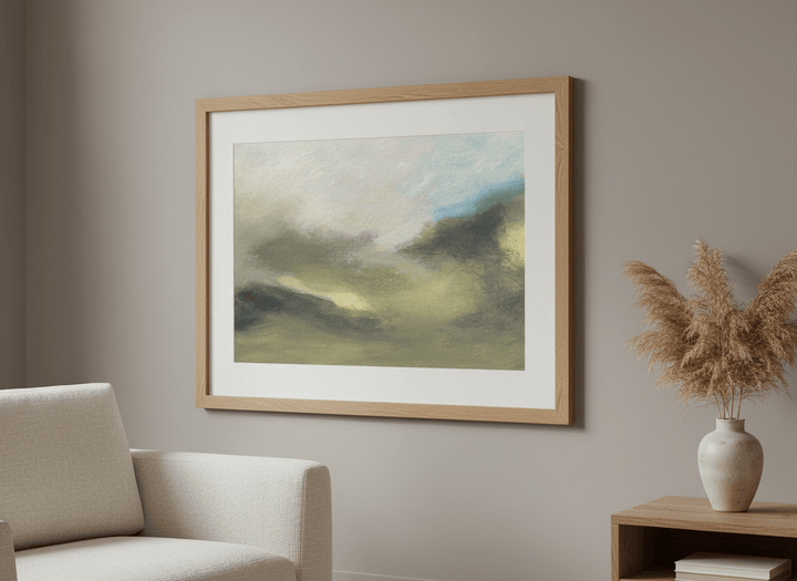Modern wall art styled above a sofa in a neutral living room