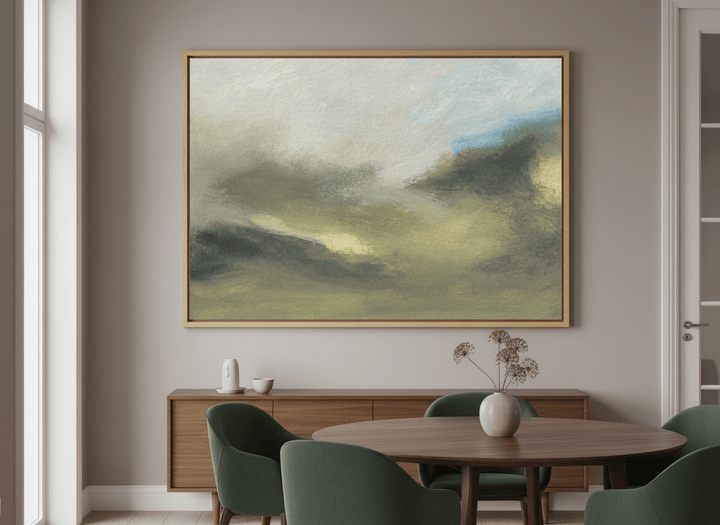 Wall art styled above a dining table in a contemporary home