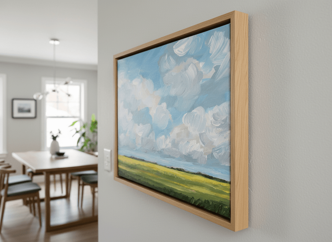 Wall art styled above a dining table in a contemporary home
