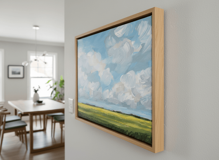 Wall art styled above a dining table in a contemporary home