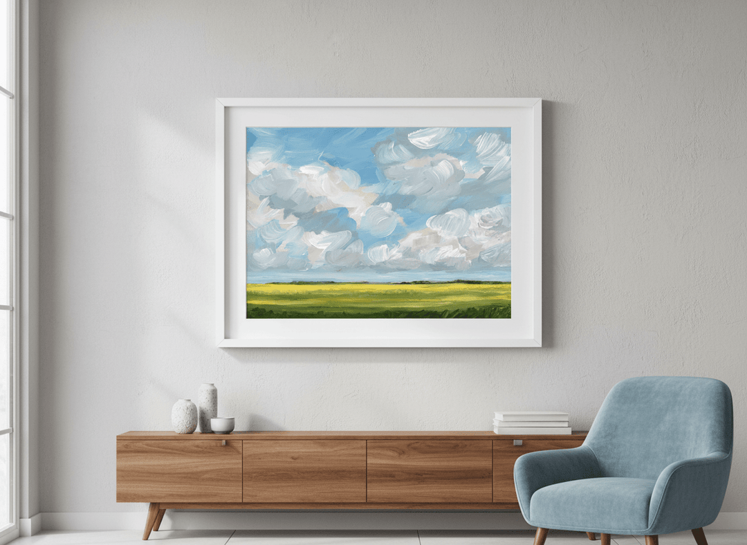 Modern wall art styled above a sofa in a neutral living room