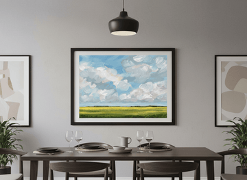 Wall art styled above a dining table in a contemporary home