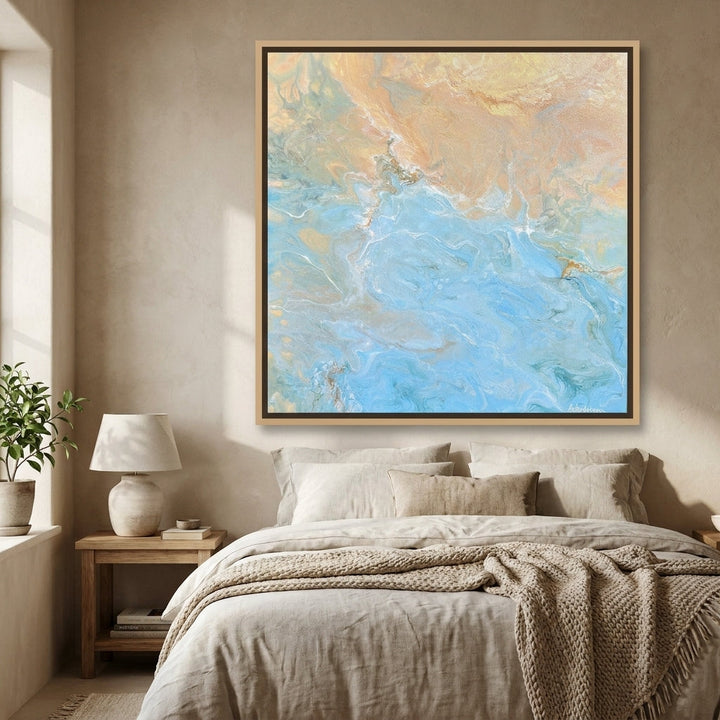 Canvas wall art with a natural timber surround styled in a calm, light-filled bedroom