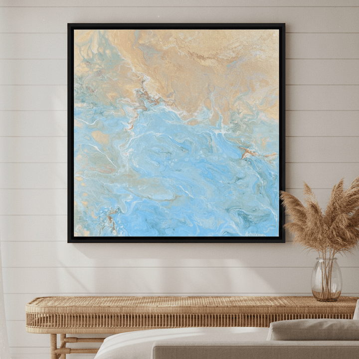 Oversized statement canvas wall art with a black surround styled in a sunny coastal beach house