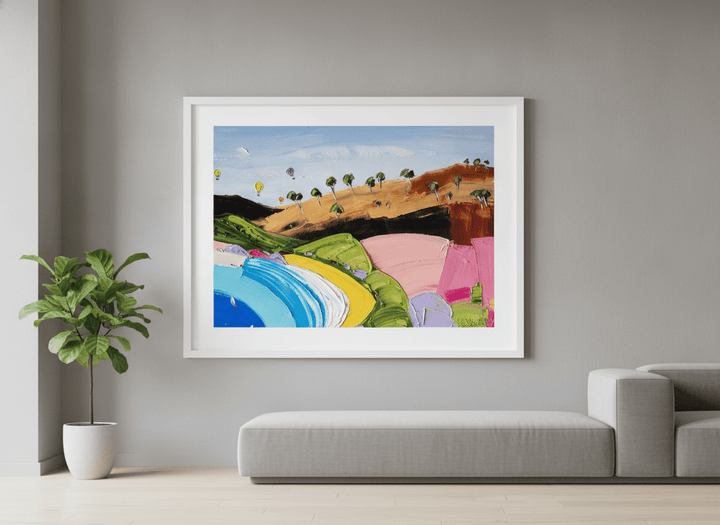 Modern wall art styled above a sofa in a neutral living room