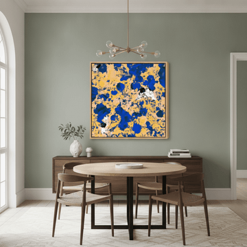 Oversized statement canvas wall art with a natural timber surround styled in a contemporary dining room