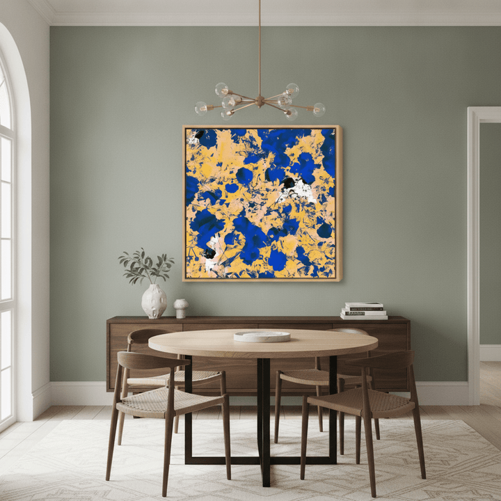 Oversized statement canvas wall art with a natural timber surround styled in a contemporary dining room