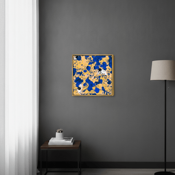 Canvas wall art with a gold leaf surround styled in a bright modern office