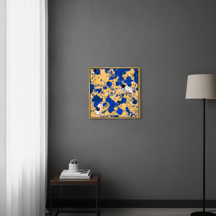 Canvas wall art with a gold leaf surround styled in a bright modern office