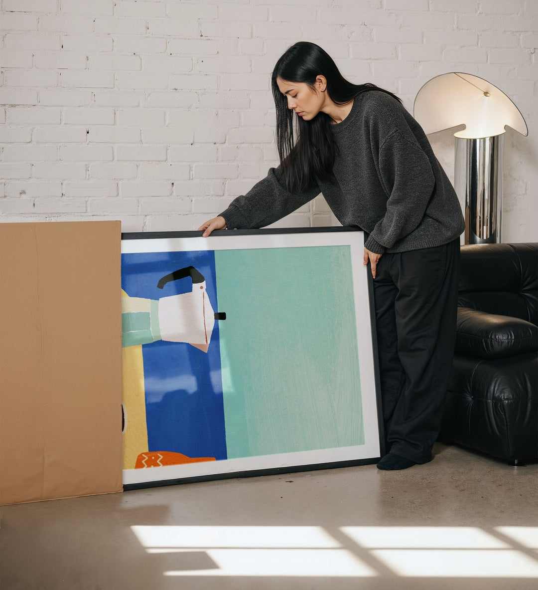 girl unboxing an artwork