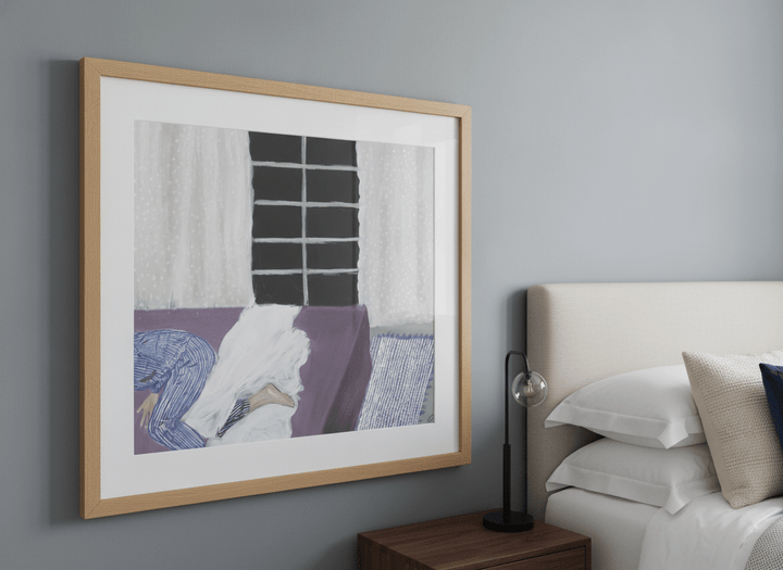 Minimalist artwork displayed in a calm, light-filled bedroom interior