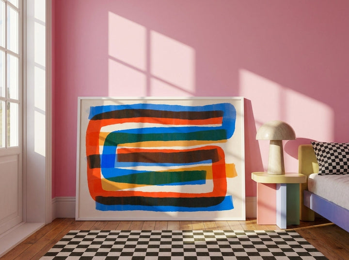 Oversized statement modern wall art print leaning against the wall in a colourful eclectic bedroom