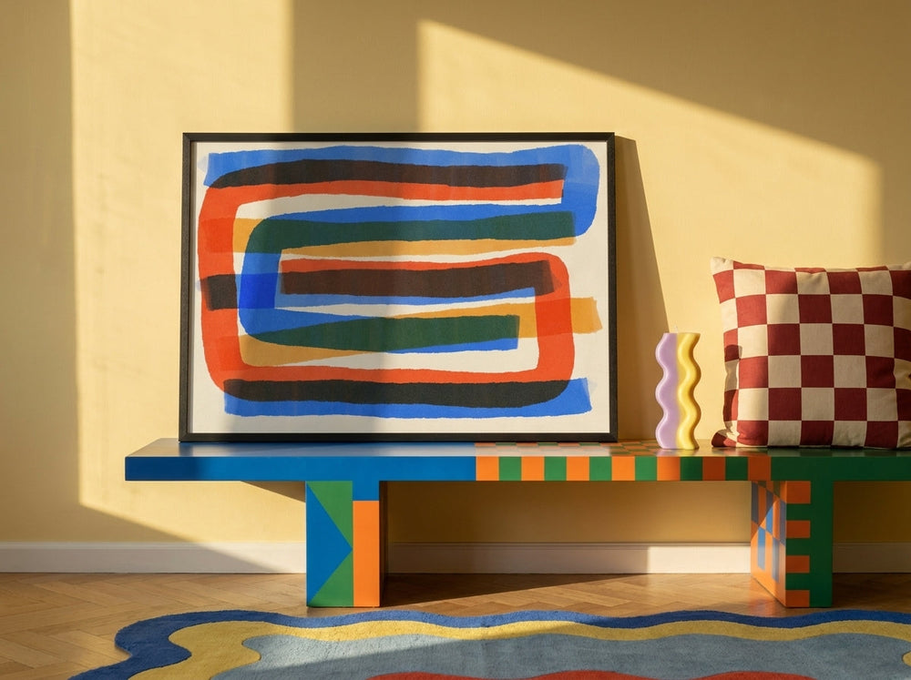 Modern wall art print standing on a side table in a colourful eclectic home office