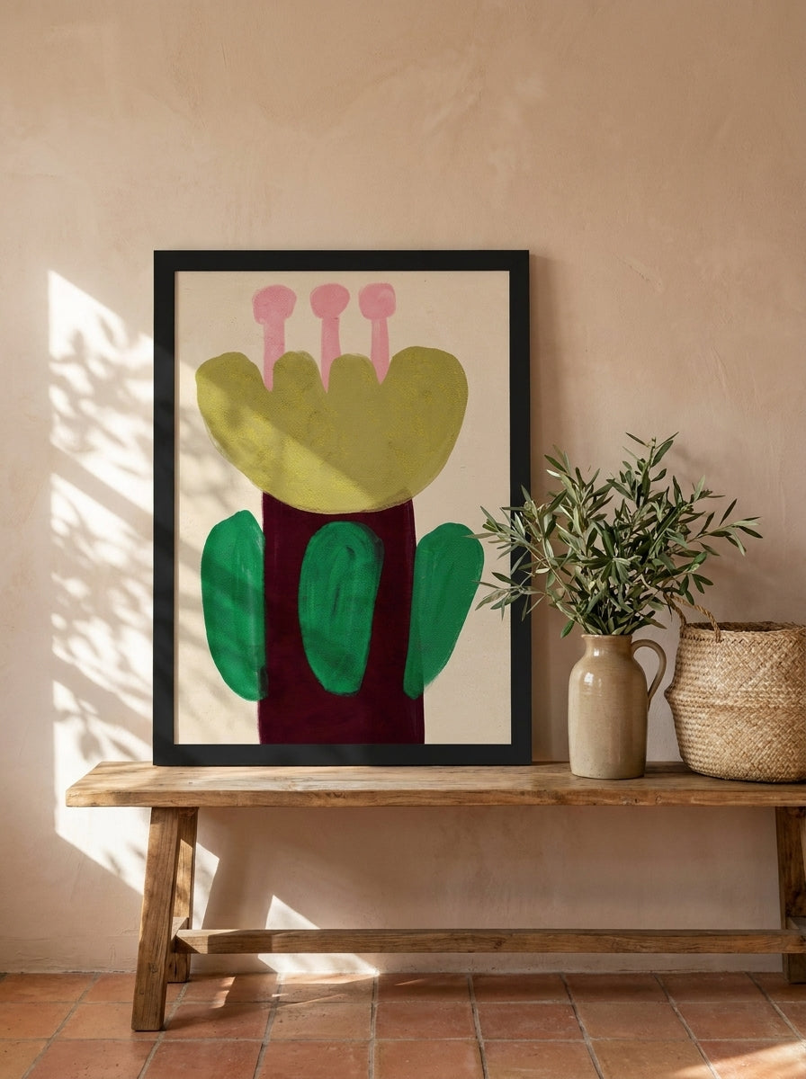 Modern wall art print standing on a bench in a Mediterranean bedroom