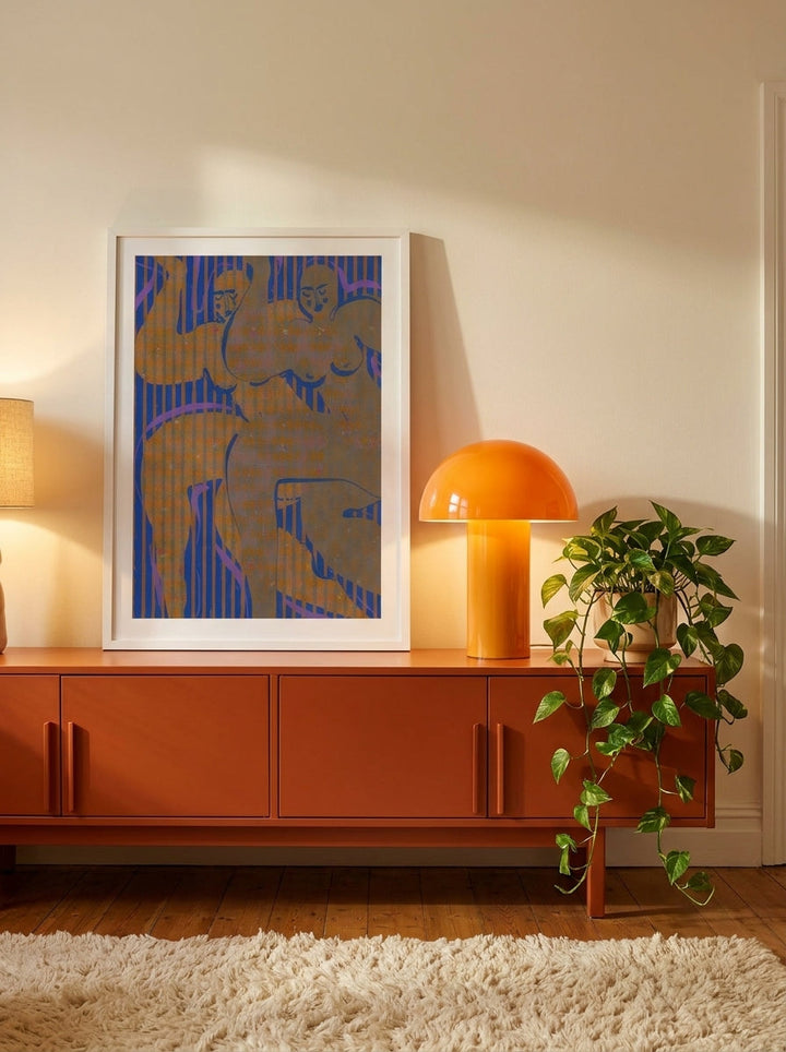 Modern wall art print standing on a sideboard in a retro 70s home office