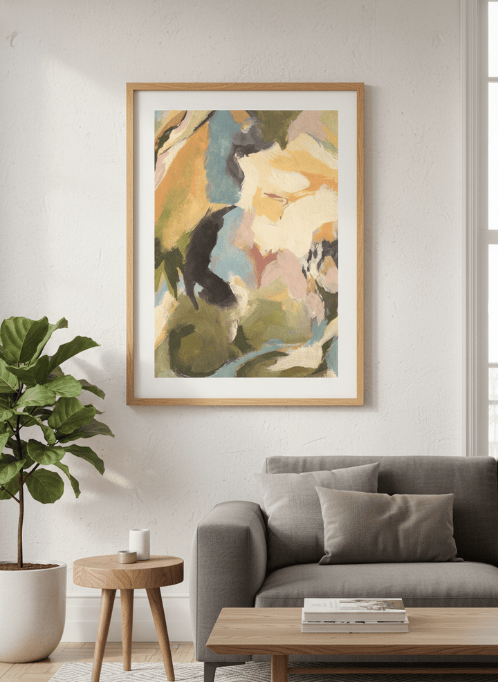 Modern wall art styled above a sofa in a neutral living room