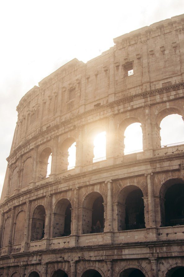 Sunlight shining through the Colosseum in Rome, Italy framed