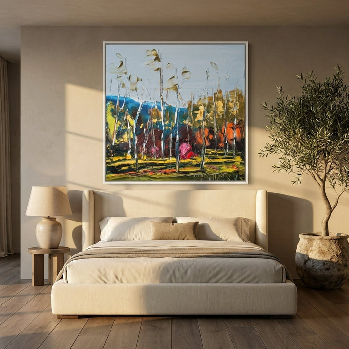 Oversized statement canvas wall art with a white surround styled on the wall in a luxe bedroom