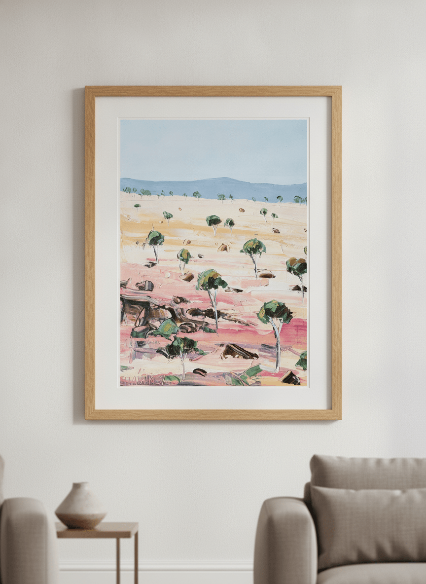 Modern wall art styled above a sofa in a neutral living room