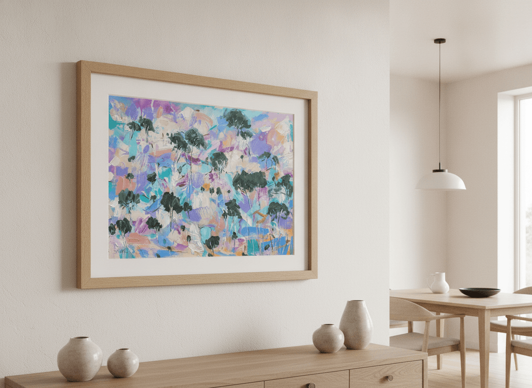 Wall art styled above a dining table in a contemporary home