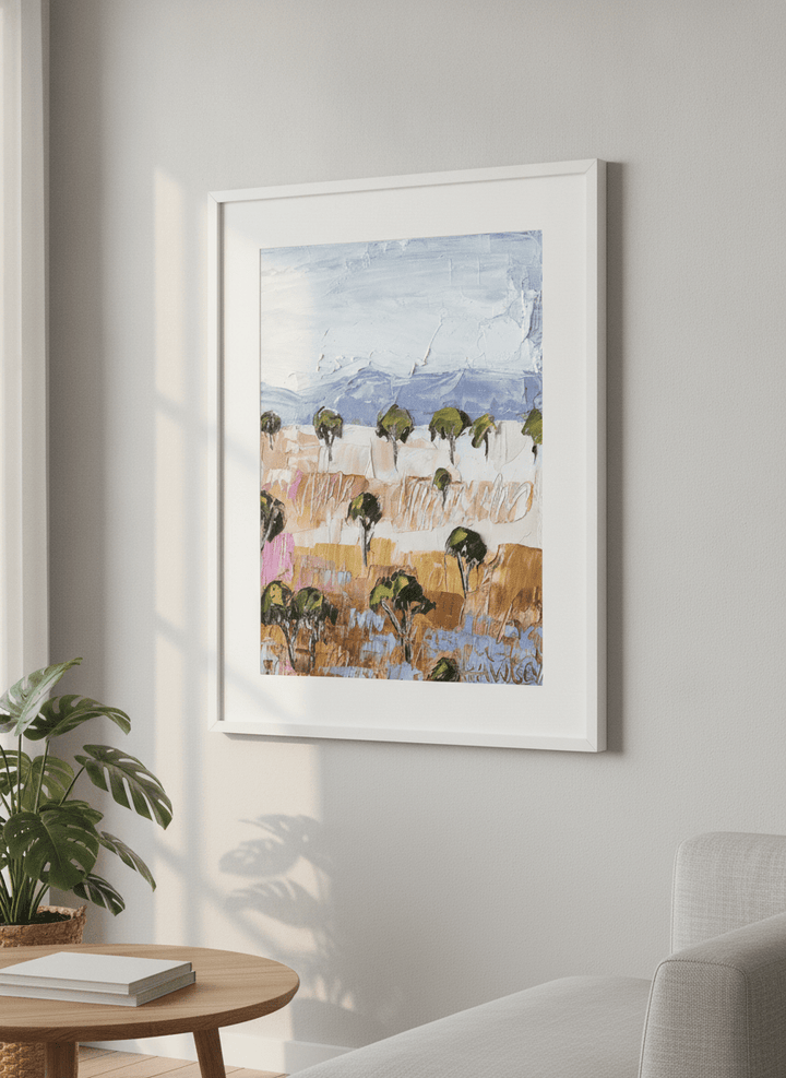 Modern wall art styled above a sofa in a neutral living room