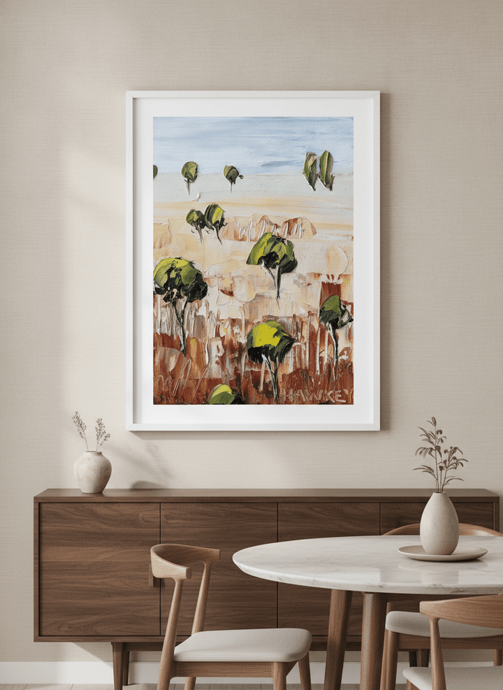 Wall art styled above a dining table in a contemporary home