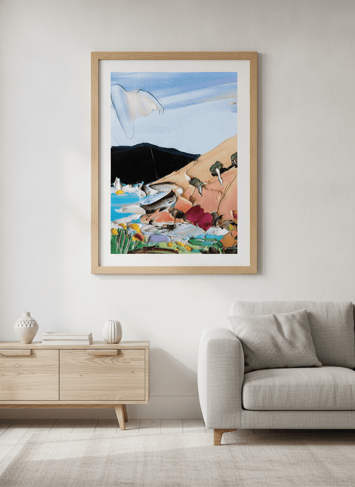 Modern wall art styled above a sofa in a neutral living room